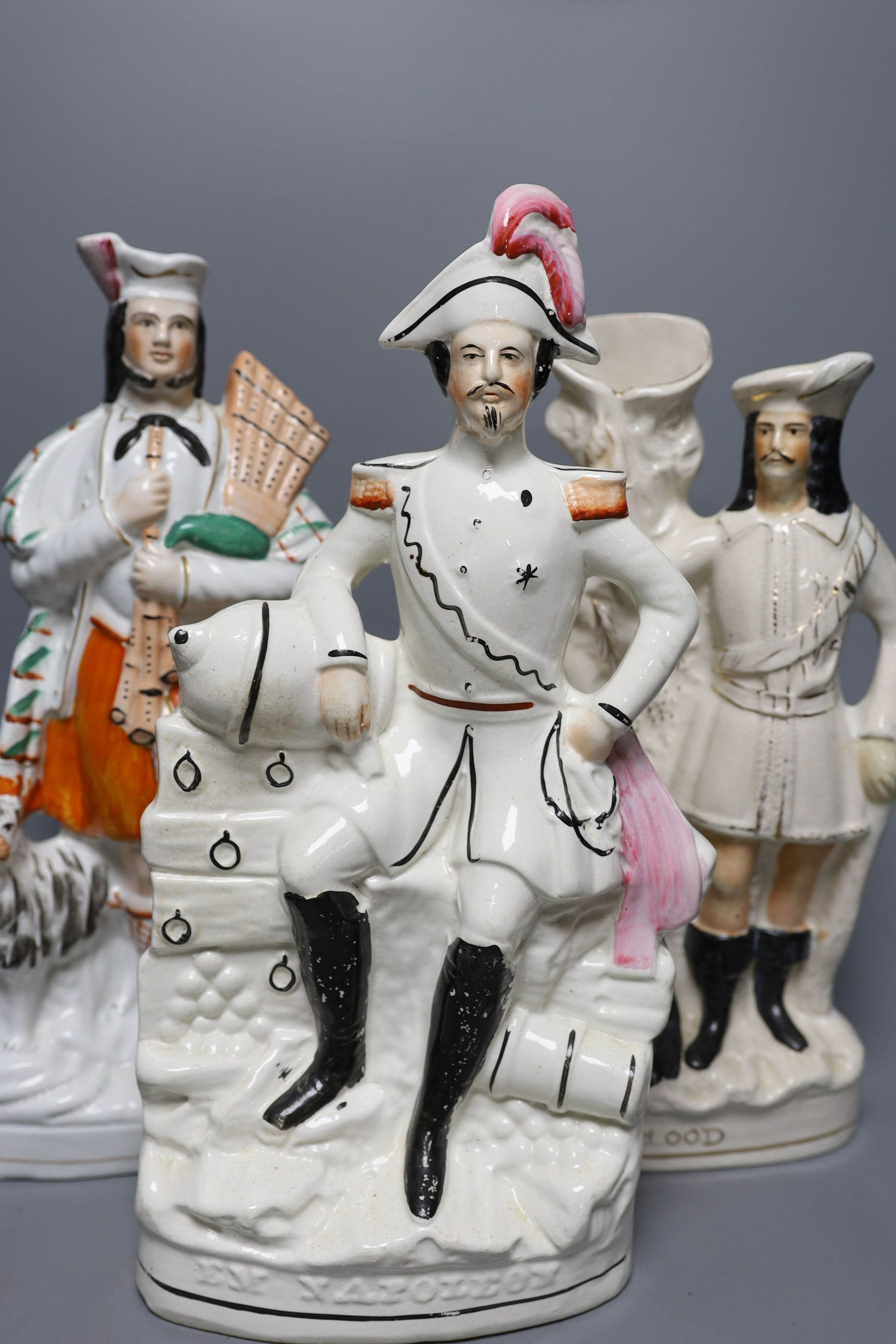Four 19th century Staffordshire pottery groups - 40cm tall